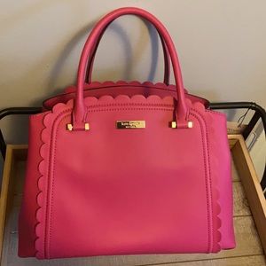 Fuschia colored Kate Spade bag.
